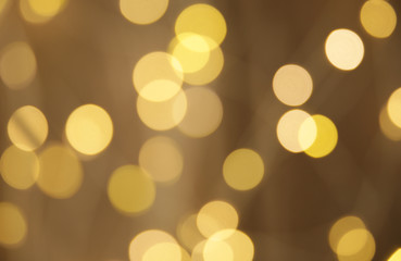 Obraz premium abstract background with gold lights. Gold bokeh banner. Golden glitter. Festive sparkles. Empty background. Blurry texture. Defocus pattern. Abstract template. Retro background. Vintage confetti .