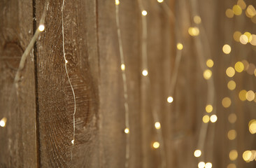 abstract wooden background with gold lights. Gold bokeh banner. Golden glitter. Festive sparkles. Empty background., texture, pattern. Abstract template. Retro, vintage.