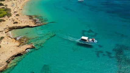 Aerial drone top view photo of beautiful volcanic rocky seascape with turquoise waters, Koufonisi island, small Cyclades, Greece