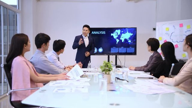 Business concepts. The young man was accepted by colleagues at the meeting.  4k Resolution.