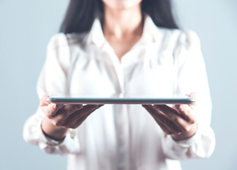 woman hand holding tablet