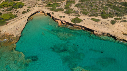 Fototapeta na wymiar Aerial drone top view photo of beautiful volcanic rocky seascape with turquoise waters, Koufonisi island, small Cyclades, Greece