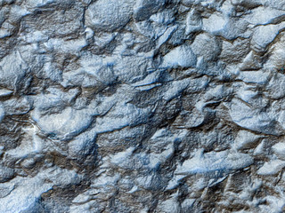 The uneven stone structure is gray-blue