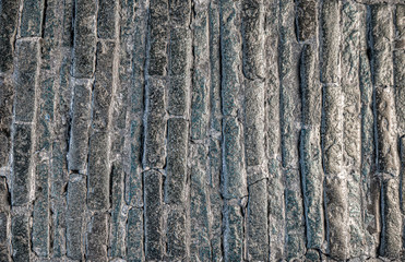Obraz premium The rough surface of an old stone pavement