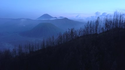 AERIAL: Landscape of caldera Bromo volcano early morning, Java island, Indonesia