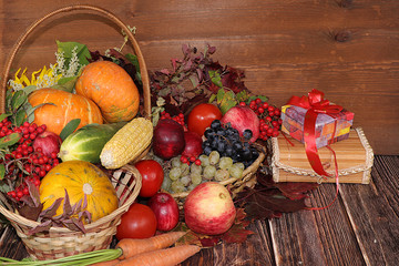 Thanksgiving, autumn background with seasonal autumn nature berries, pumpkins, apples, gifts and leaves on wooden background, copy space. Happy Thanksgiving concept, selective focus.