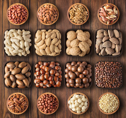mix nuts bowls on table background. nutritious organic food for snack.