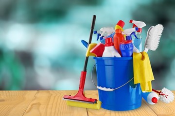 Plastic bottles, cleaning sponge and gloves  on background