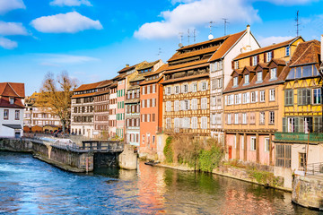 Obraz premium Traditional half-timbered houses on picturesque canals in La Petite France in the medieval fairytale town of Strasbourg, UNESCO World Heritage Site, Alsace, France.