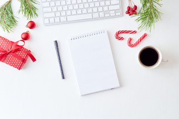 Mockup white notebook with pine branches and keyboard, christmas decorations  on a white background