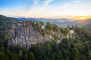 Fototapeta na wymiar Aerial view of steep rock with ruins of Vranov Castle in Mala Skala, Czechia