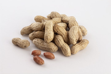a group of shelled peanuts on white background