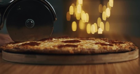 Preparing a mouthwatering pizza at home. Shot in RAW on a cinema camera.