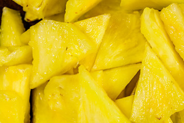 Pieces of chopped pineapple for the background