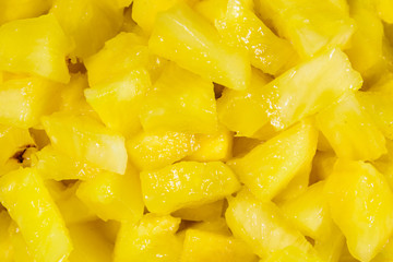 Pieces of chopped pineapple for the background