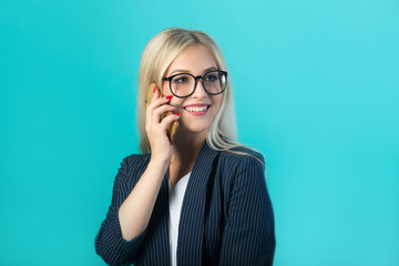 beautiful young woman in a black suit with glasses calls on the phone