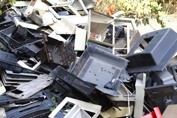 Garbage, old office equipment. Electronic waste devices consist of a monitor, a printer, a desktop computer and a fax for reuse. Plastic, copper, glass can be reused, recycled or recycled. - obrazy, fototapety, plakaty