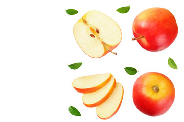 red apples with slices and green leaves isolated on a white background. top view