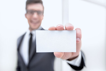 businessman showing a blank business card