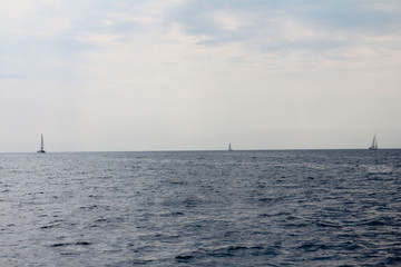 three sailing boats in the sea