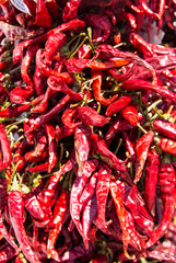 Dried red chilli paprika on a market stall.