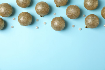 Christmas balls on blue background, top view