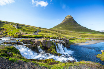 Fototapeta na wymiar Kirkjufellsfoss, a summer morning at the waterfalls. Iceland