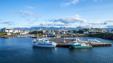 Fototapeta na wymiar Kirkjufellsfoss, Iceland »; August 2017: Fishing port of the rural village of Kirkjufellfoss