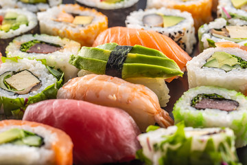 Assortment of japanese sushi rolls nigiri sashimi and maki