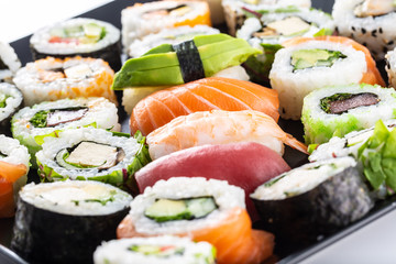 Assortment of japanese sushi rolls nigiri sashimi and maki