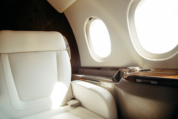 modern and comfortable interior of business jet aircraft with decor