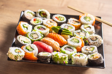 Assortment of japanese sushi rolls nigiri sashimi and maki