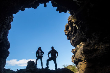 Myvatn Iceland »; August 2017: Two young men in a small cave on a path of Lake Myvatn