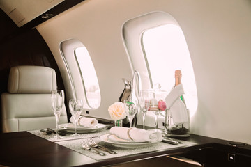 modern and comfortable interior of business jet aircraft with decor