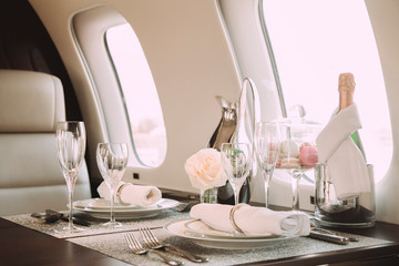 modern and comfortable interior of business jet aircraft with decor