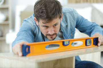 man working on a new kitchen installation