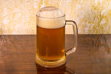 a glass of foam viv with a table