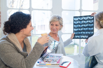 women smiling holding scan result