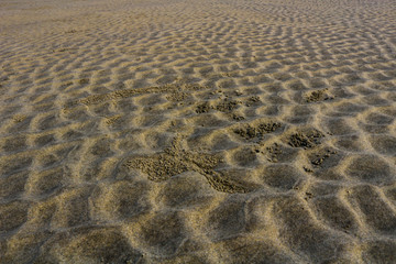 Fototapeta na wymiar Wave of sand on beach
