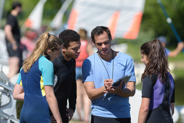 sail instructor checking the student attendance