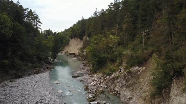 Droneshot over River through Gorge