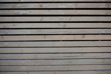 Fototapeta premium Wooden cracked gray wooden wall, horizontal wallpaper