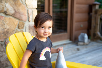 Toddler Girl With Rainbow Shirt