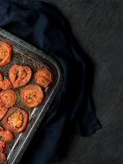 Tomatoes on baking pan. Overhead shot.