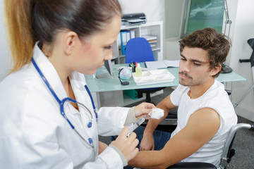a doctor doing a vaccine