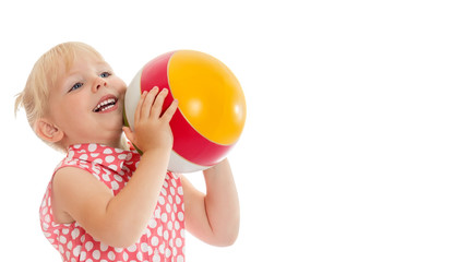 Little girl is playing with a ball.The concept of children's spo