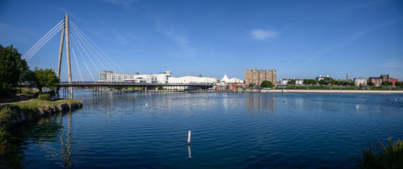 Looking northwards over the artificial lake from the ornate bridge in King's Gardens. Bridge that crosses the lake between Southport Town Centre and the Ocean Plaza on the seafront.