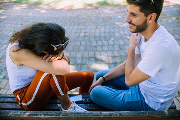 Portrait of young beautiful stylish couple in summer park