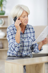 old lady reading a manual