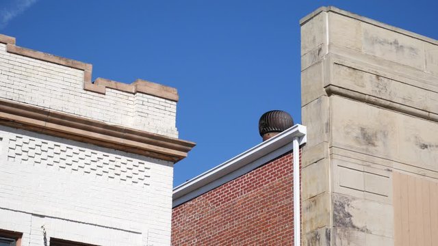 Roof electrical turbine spinning over a business